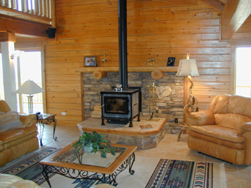 Soapstone Woodstove with Eldorado stone to reflect heat and add Beauty to the Room........